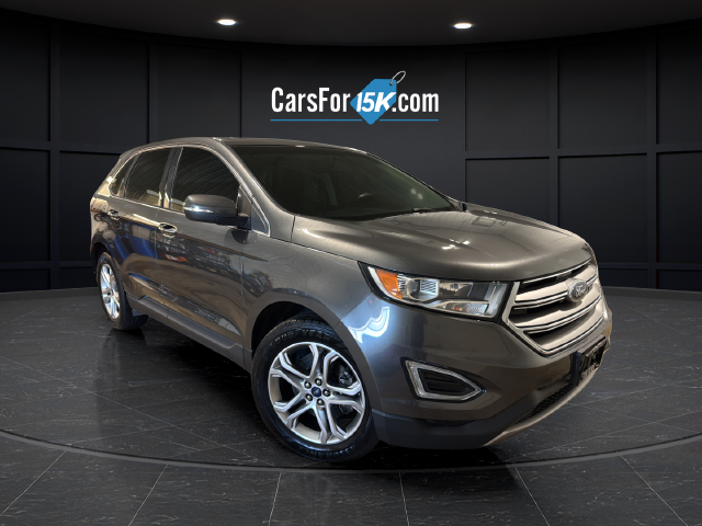 Used 2015 Magnetic Metallic Ford Titanium image 1