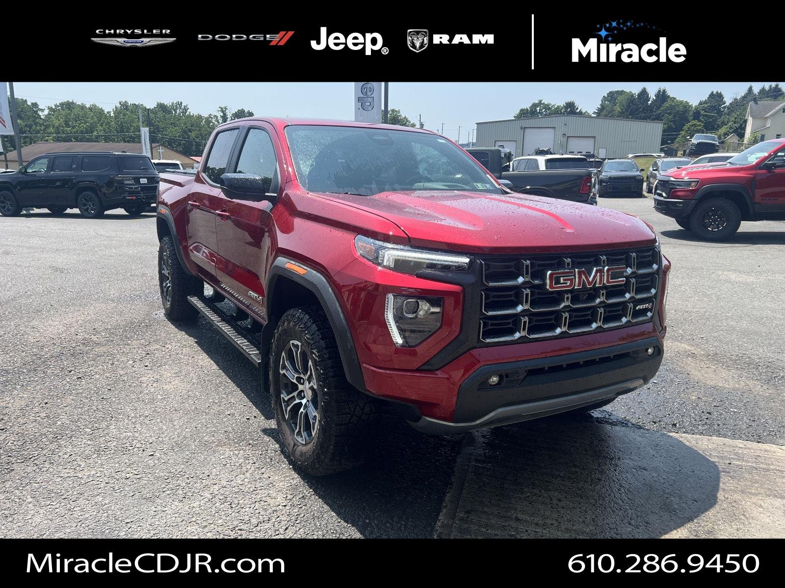 Used 2024 Volcanic Red Tintcoat GMC 4WD AT4 image 1