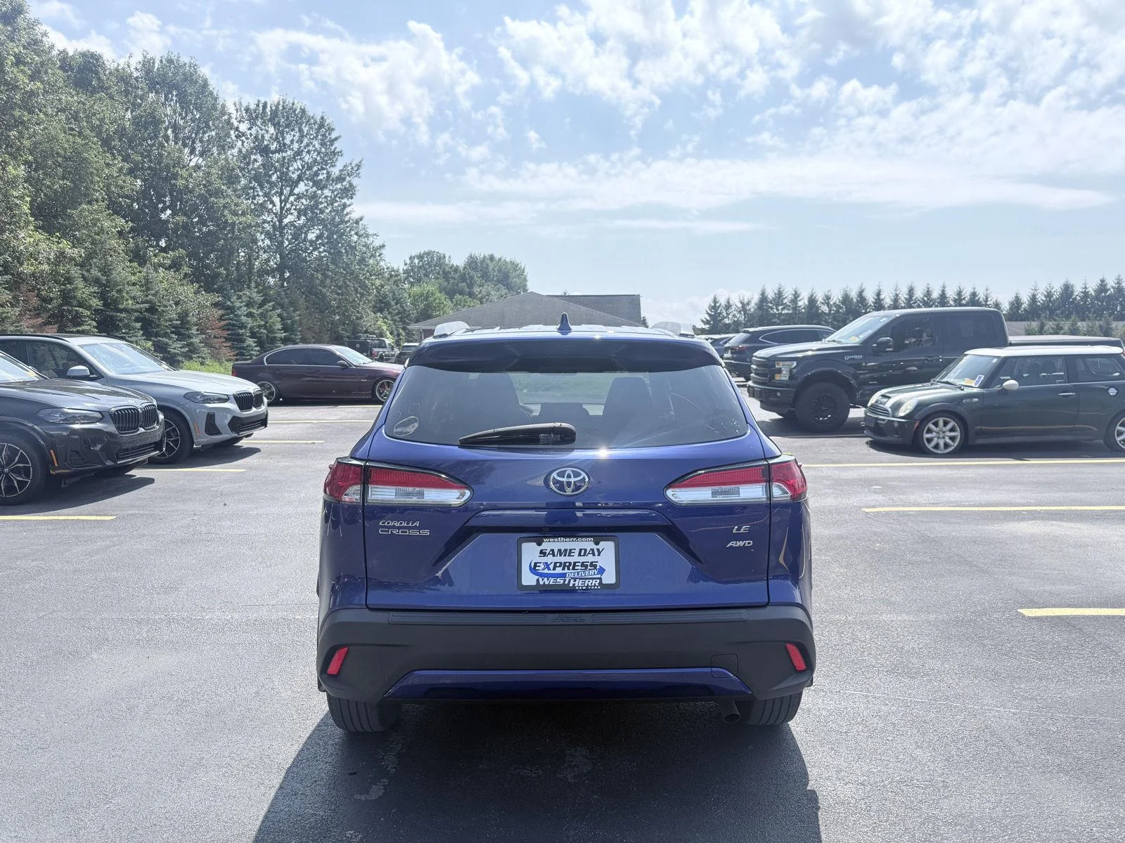 Used 2023 Blue Crush Metallic Toyota LE image 6