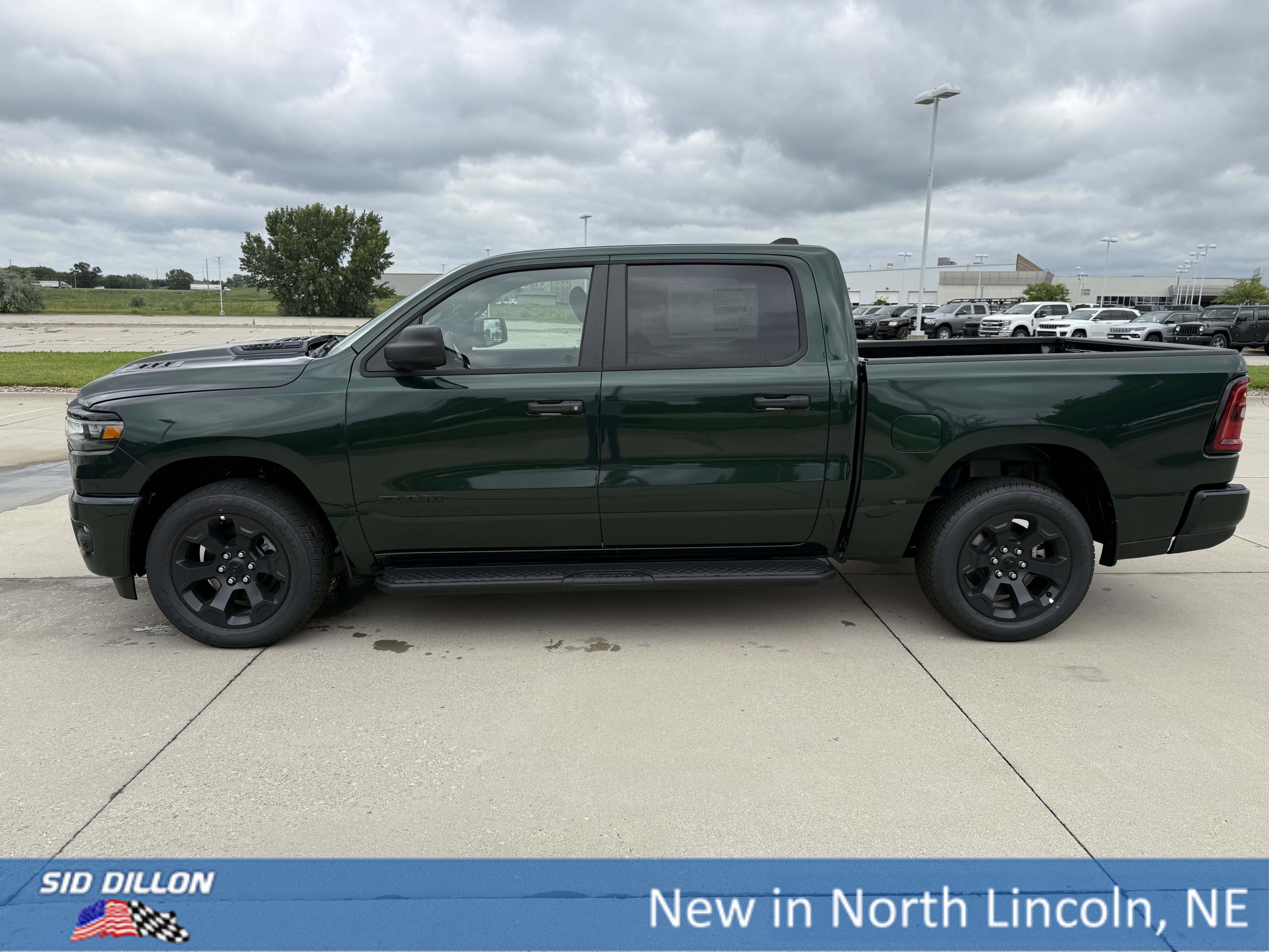 New 2026 Serrano-Green Metallic Exterior Paint RAM 4WD CREW 5