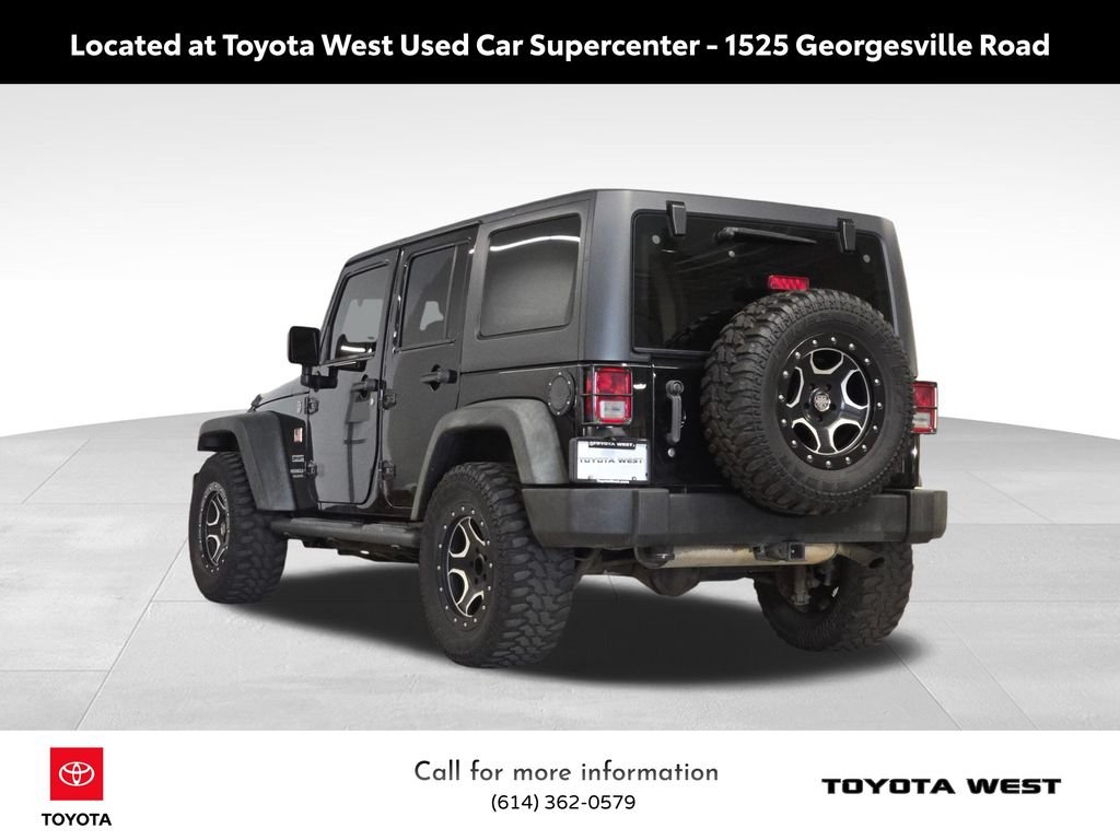 Used 2013 Black Jeep Unlimited Sport image 9