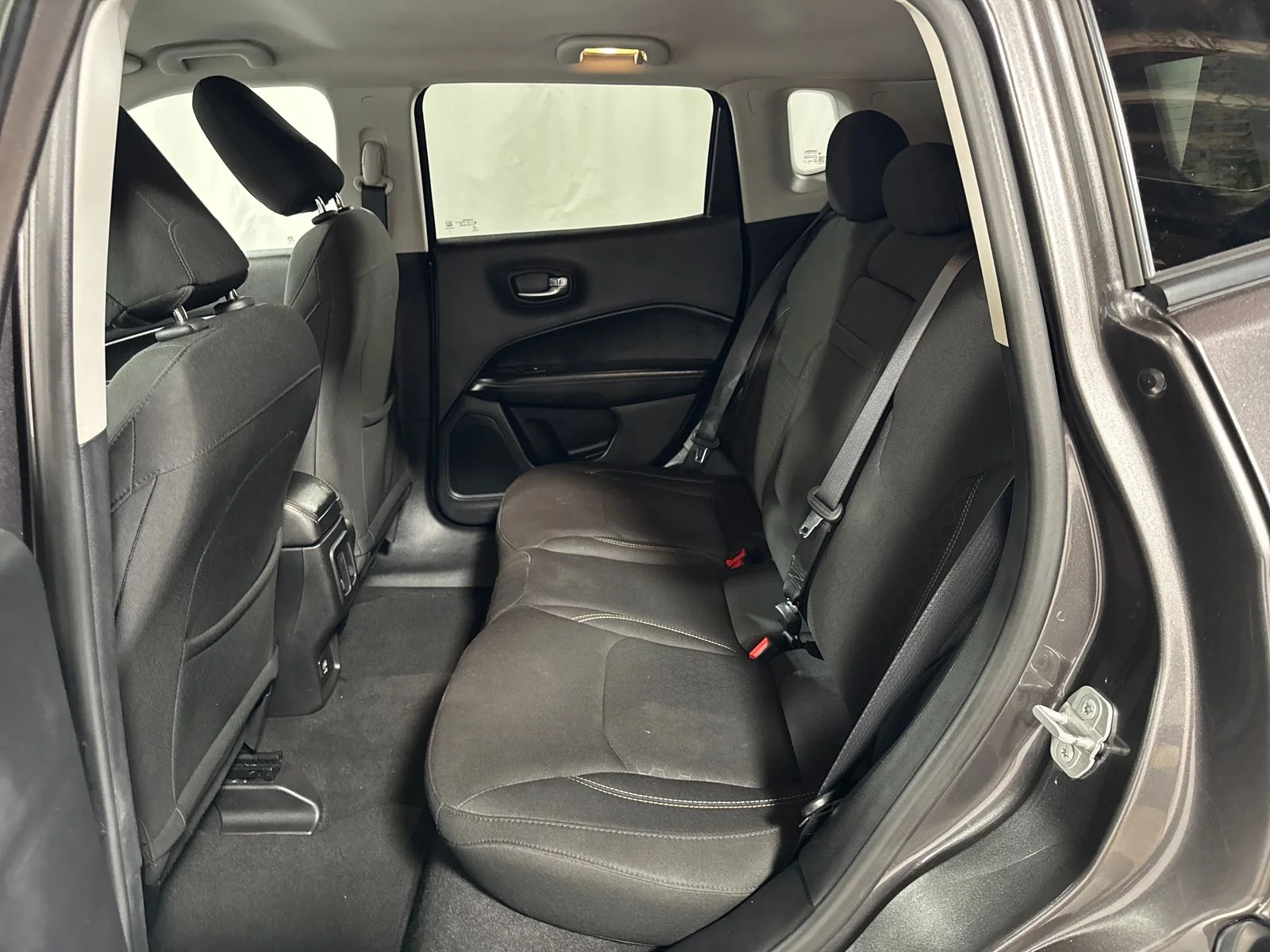 Used 2018 Granite Crystal Metallic Clearcoat Jeep Sport image 5