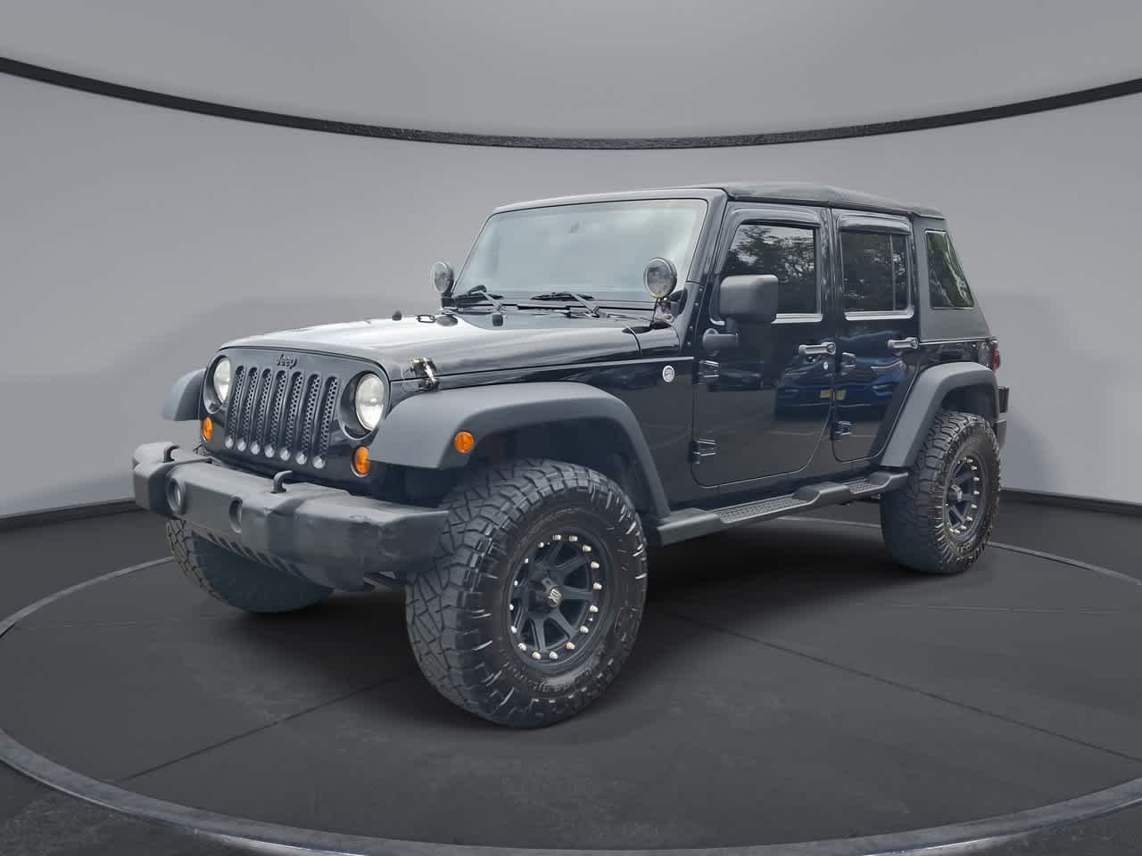 Used 2013 Black Clearcoat Jeep Sport image 1