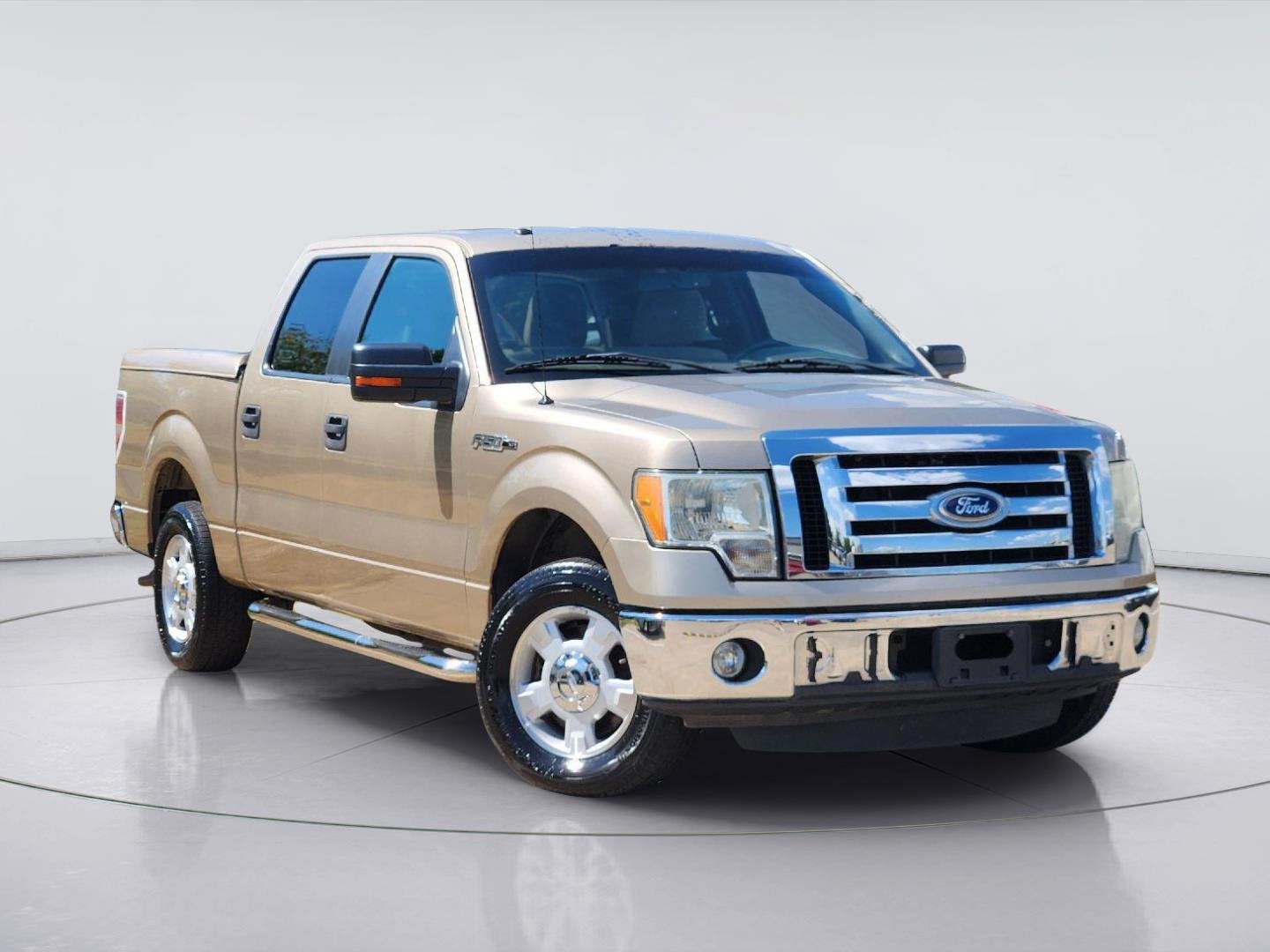 Used 2011 Pale Adobe Metallic Ford XLT image 1