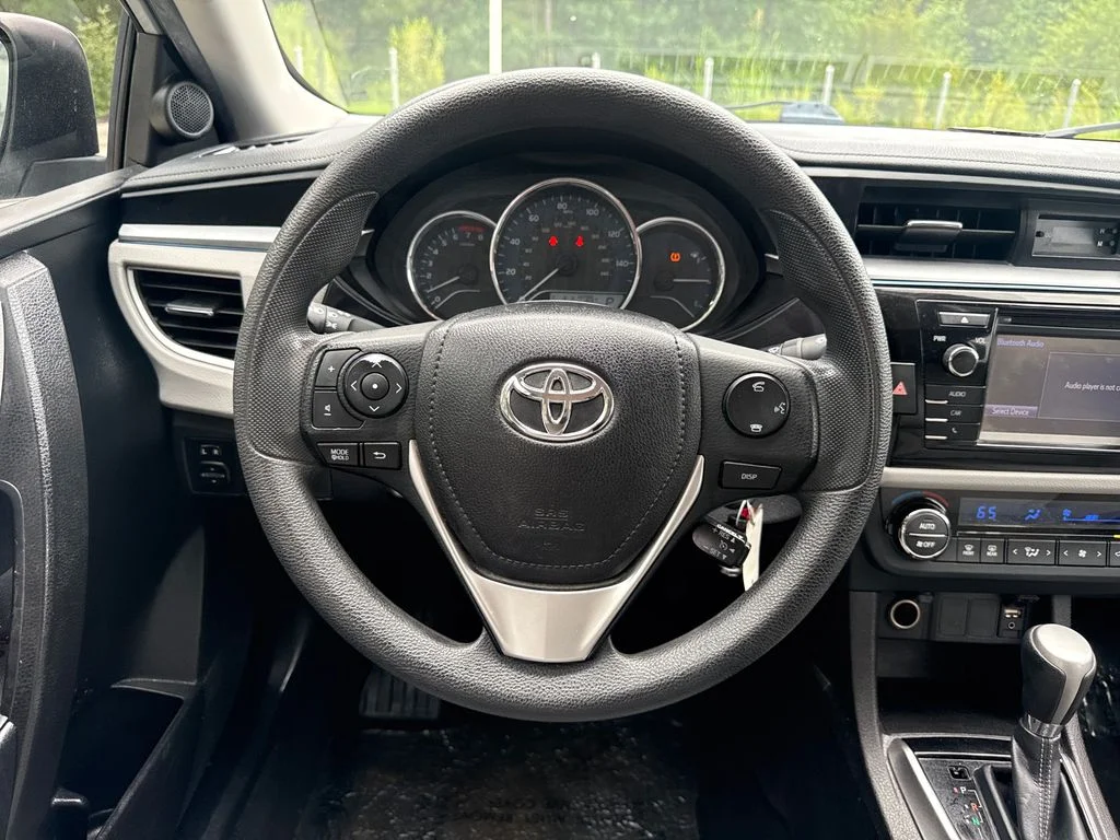 Used 2016 Classic Silver Metallic Toyota LE image 19