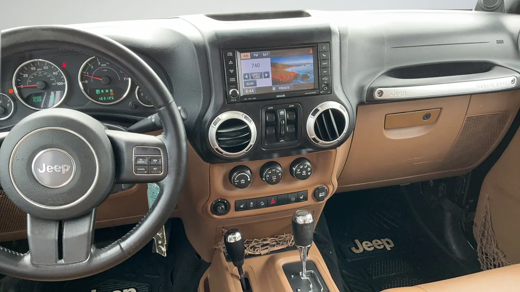 Used 2012 Black Jeep Unlimited Sahara image 8
