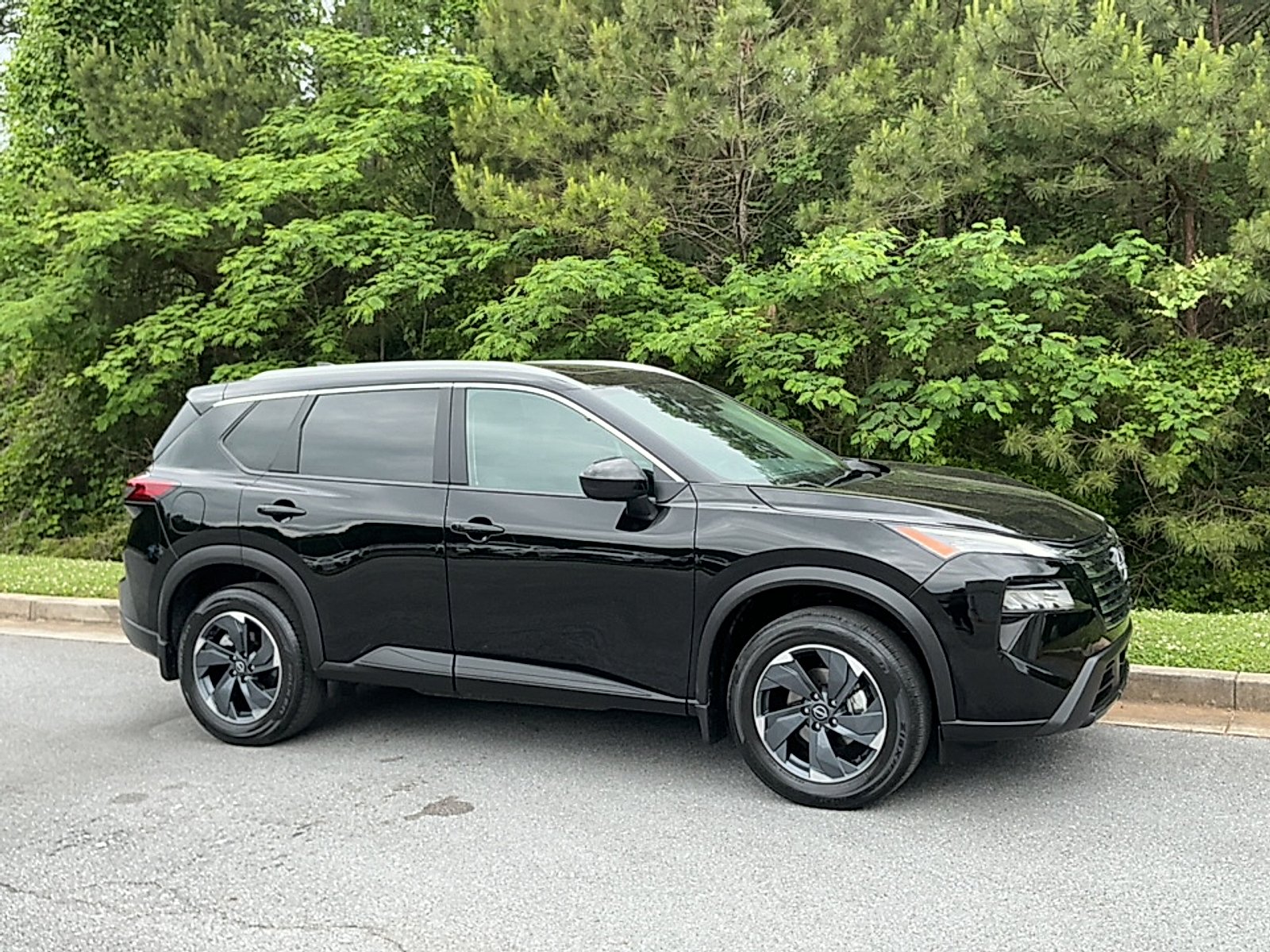 Used 2024 Super Black Nissan SV FWD image 1