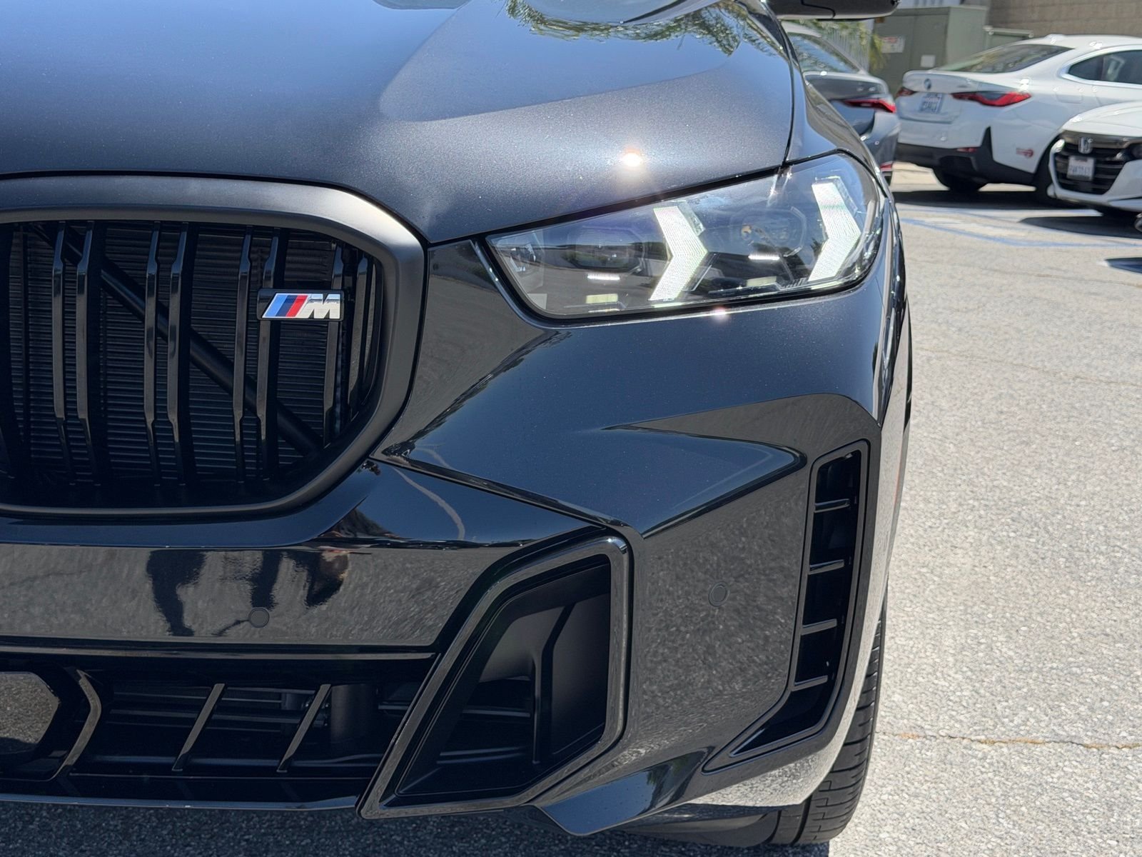 Used 2026 Black Sapphire Metallic BMW M60i image 13