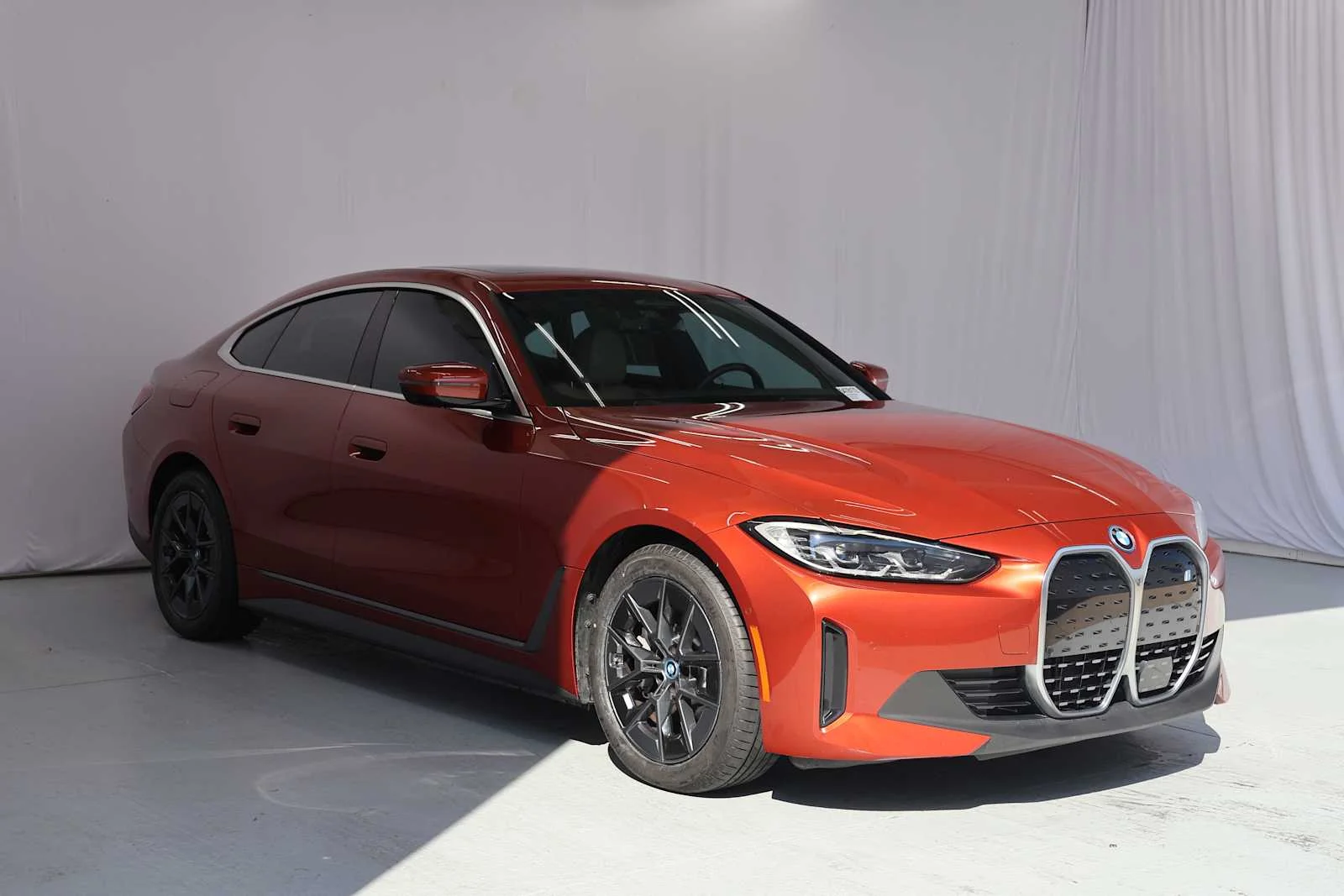 Certified Used 2023 Sunset Orange Metallic BMW eDrive40 image 3