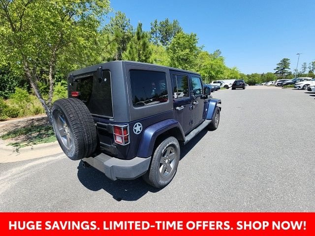 Used 2013 Blue Jeep Unlimited Sport image 15