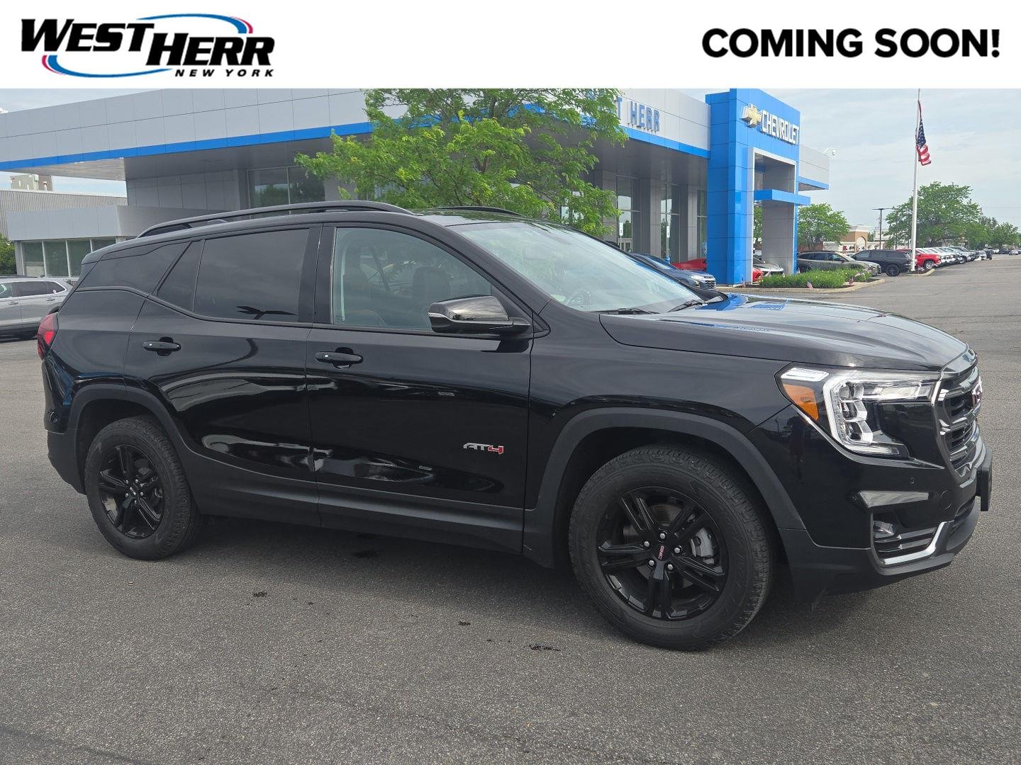Used 2023 Ebony Twilight Metallic GMC AT4 image 1
