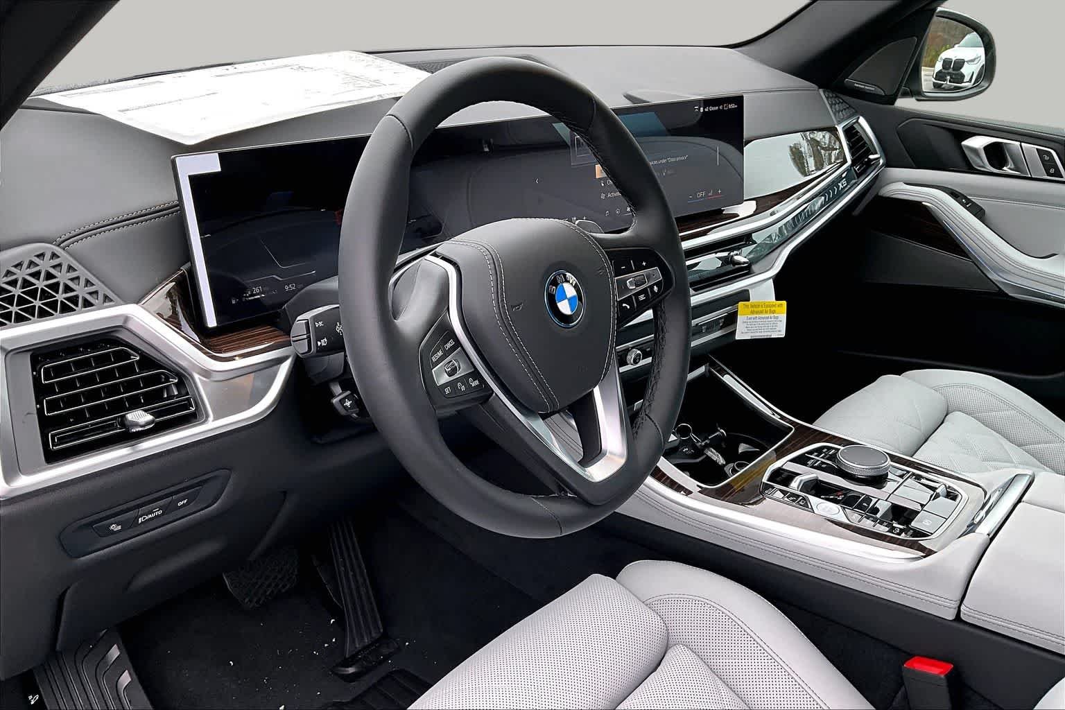 New 2026 Black Sapphire Metallic BMW xDrive50e image 9