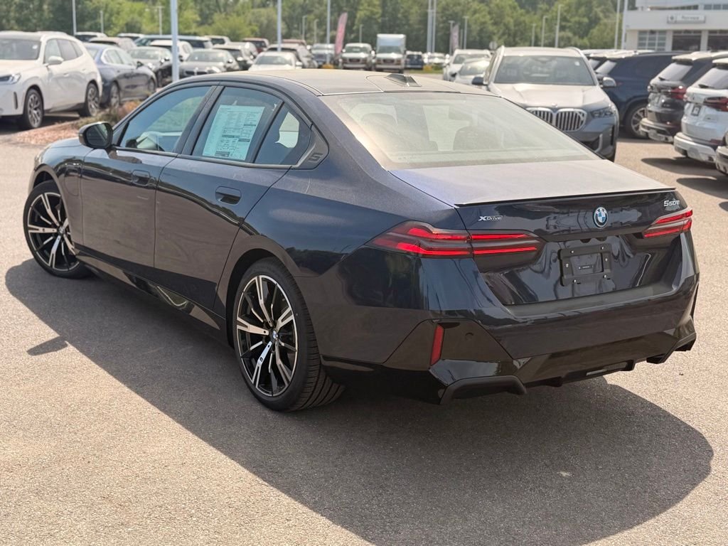 New 2027 Tanzanite Blue II Metallic BMW 550e xDrive image 3