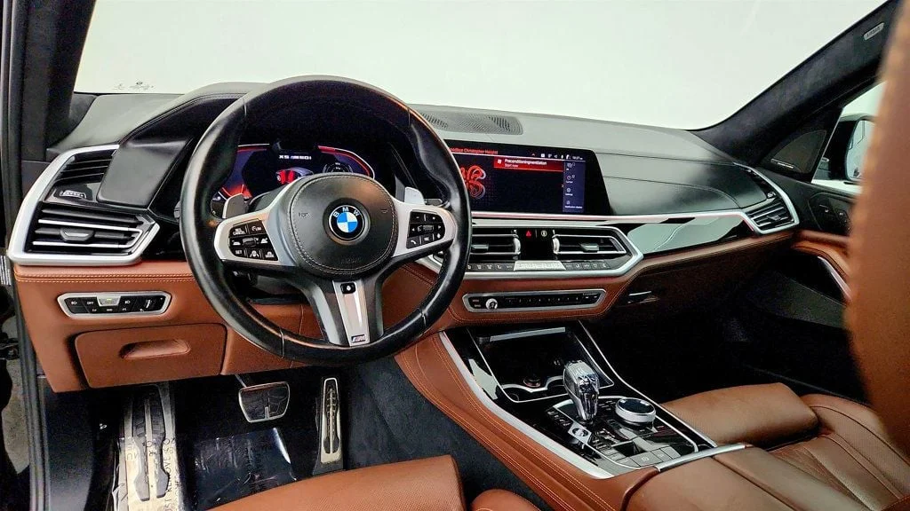 Used 2020 Black Sapphire Metallic BMW M50i Sports Activity Vehicle w/ Executive Pkg & Merino Leather image 13