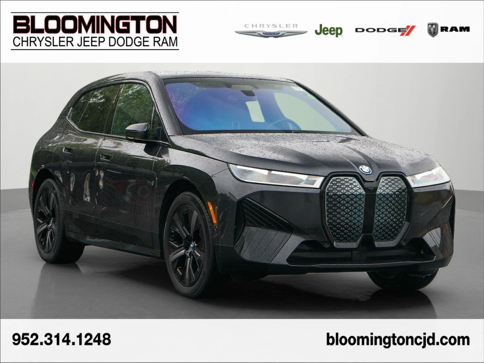 Used 2024 Dark Graphite Metallic BMW xDrive50 image 1