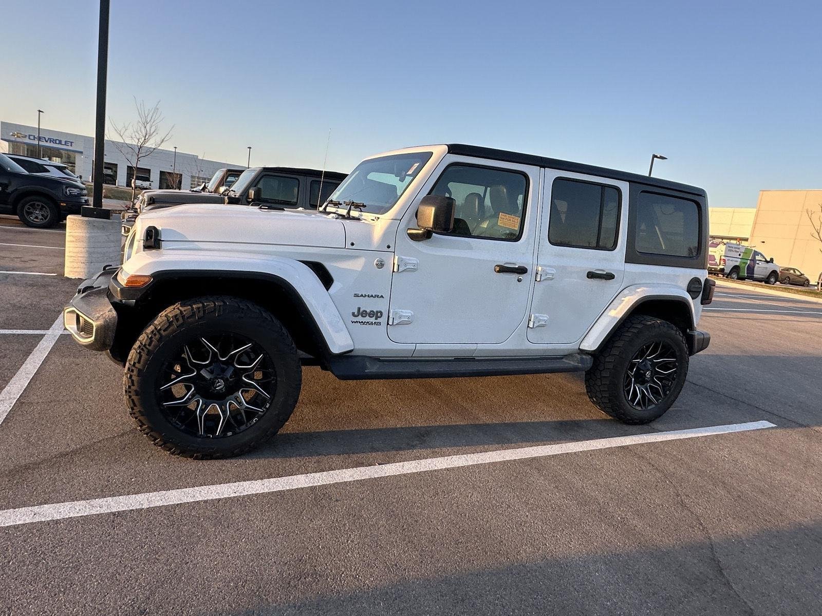 Used 2020 Jeep Wrangler Unlimited Sahara with VIN 1C4HJXEG1LW118977 for sale in Kansas City