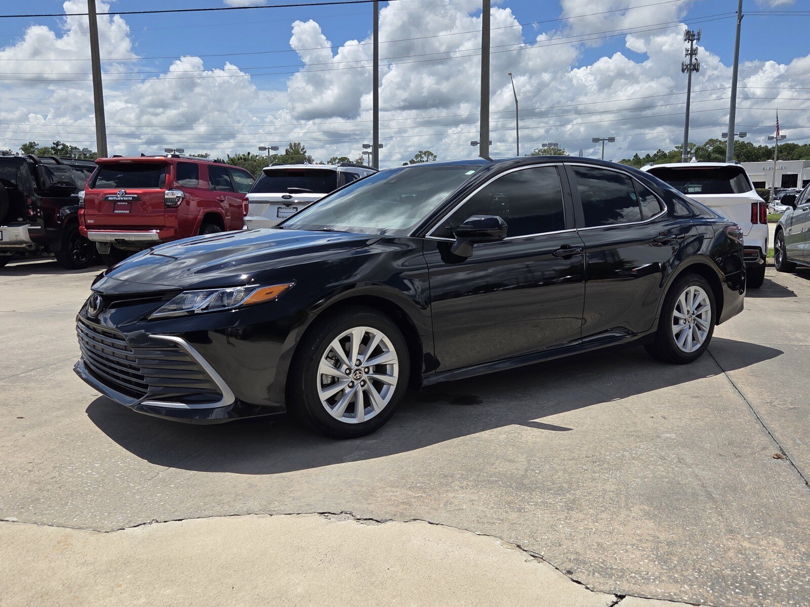 Used 2024 Midnight Black Metallic Toyota LE image 2
