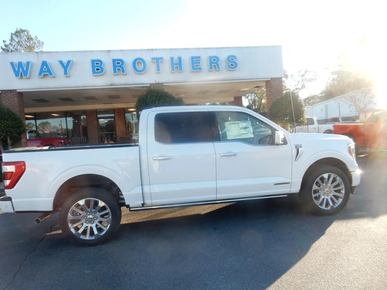 New 2023 Pearl White Ford LIMITED 4WD SUPERCREW 5.5 image 1