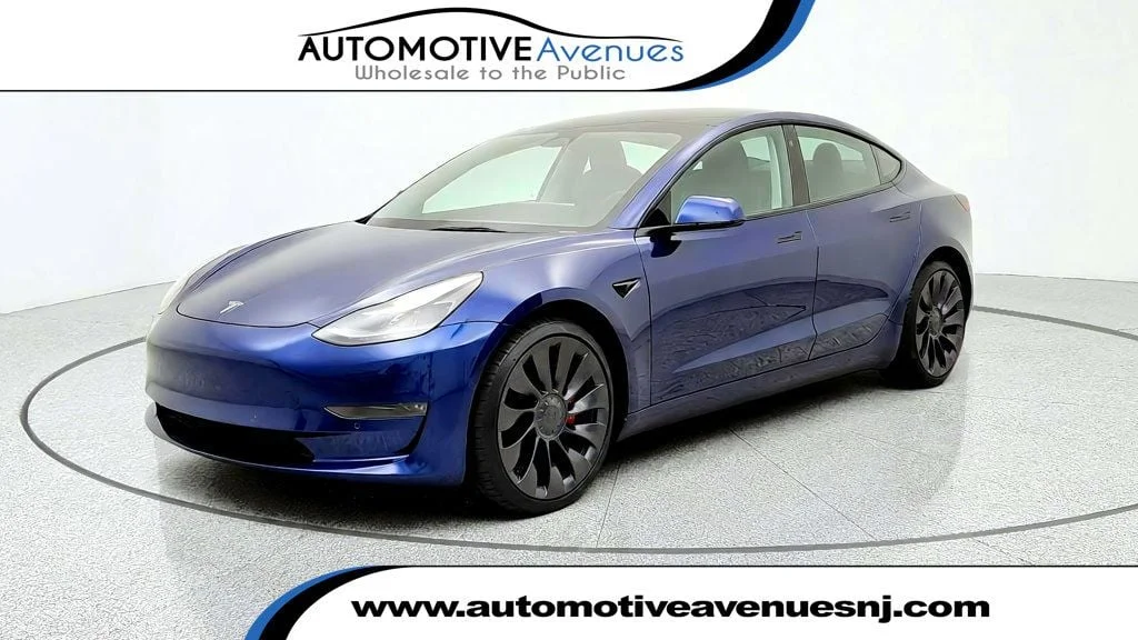 Used 2022 Deep Blue Metallic Tesla Performance AWD image 1