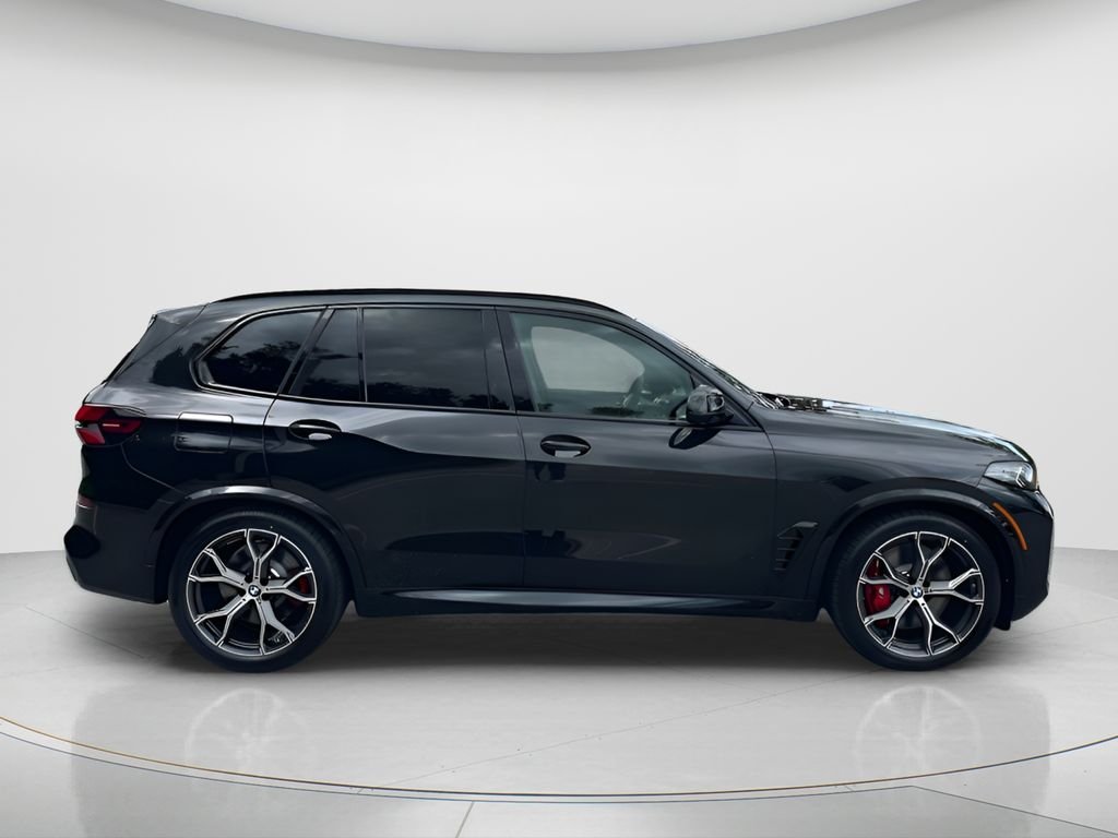 New 2026 Black Sapphire Metallic BMW xDrive50e image 4