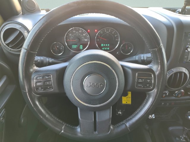 Used 2013 Green Jeep Unlimited Sport image 11
