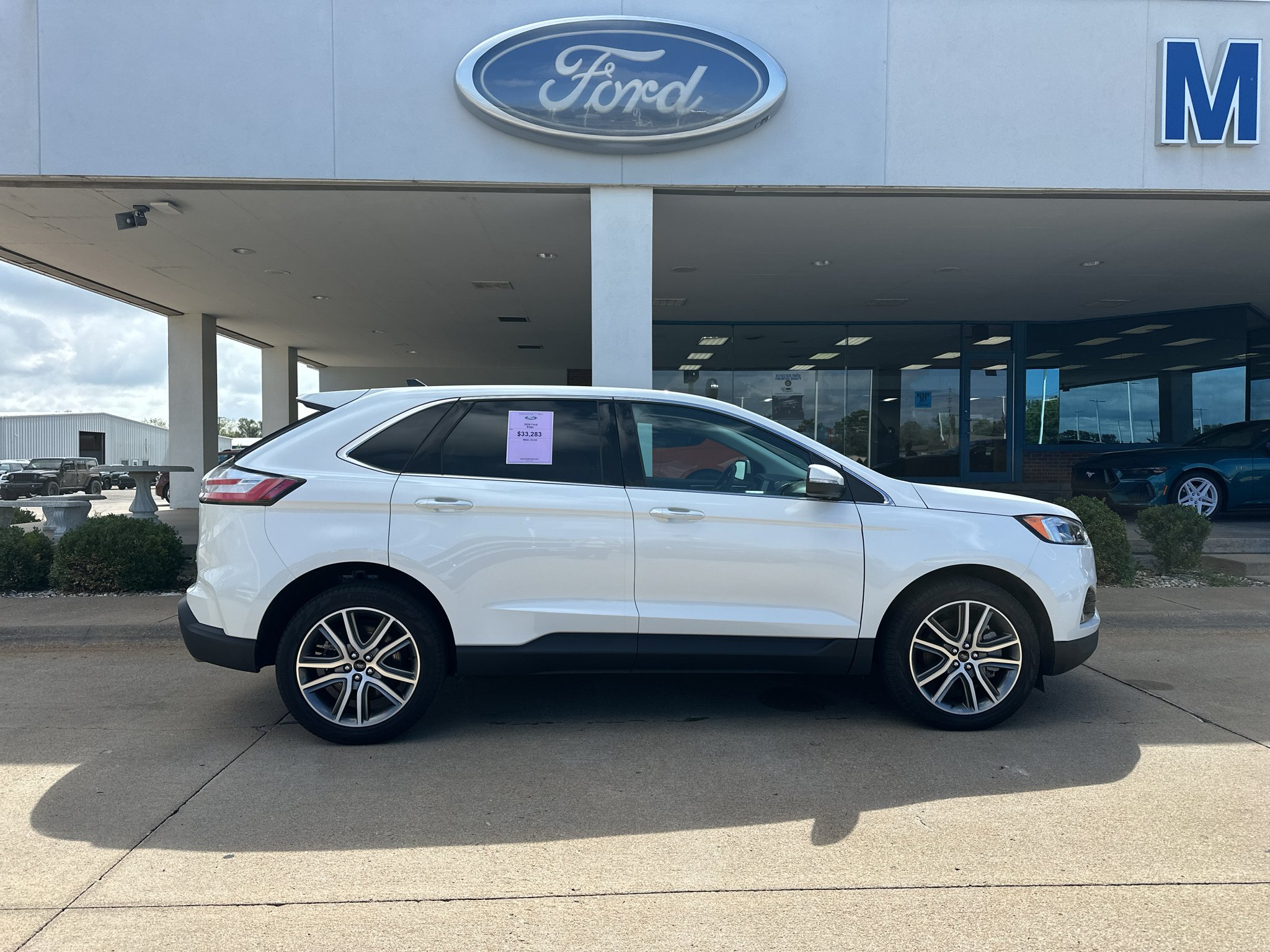 Used 2024 Star White Metallic Tri-Coat Ford Titanium image 9