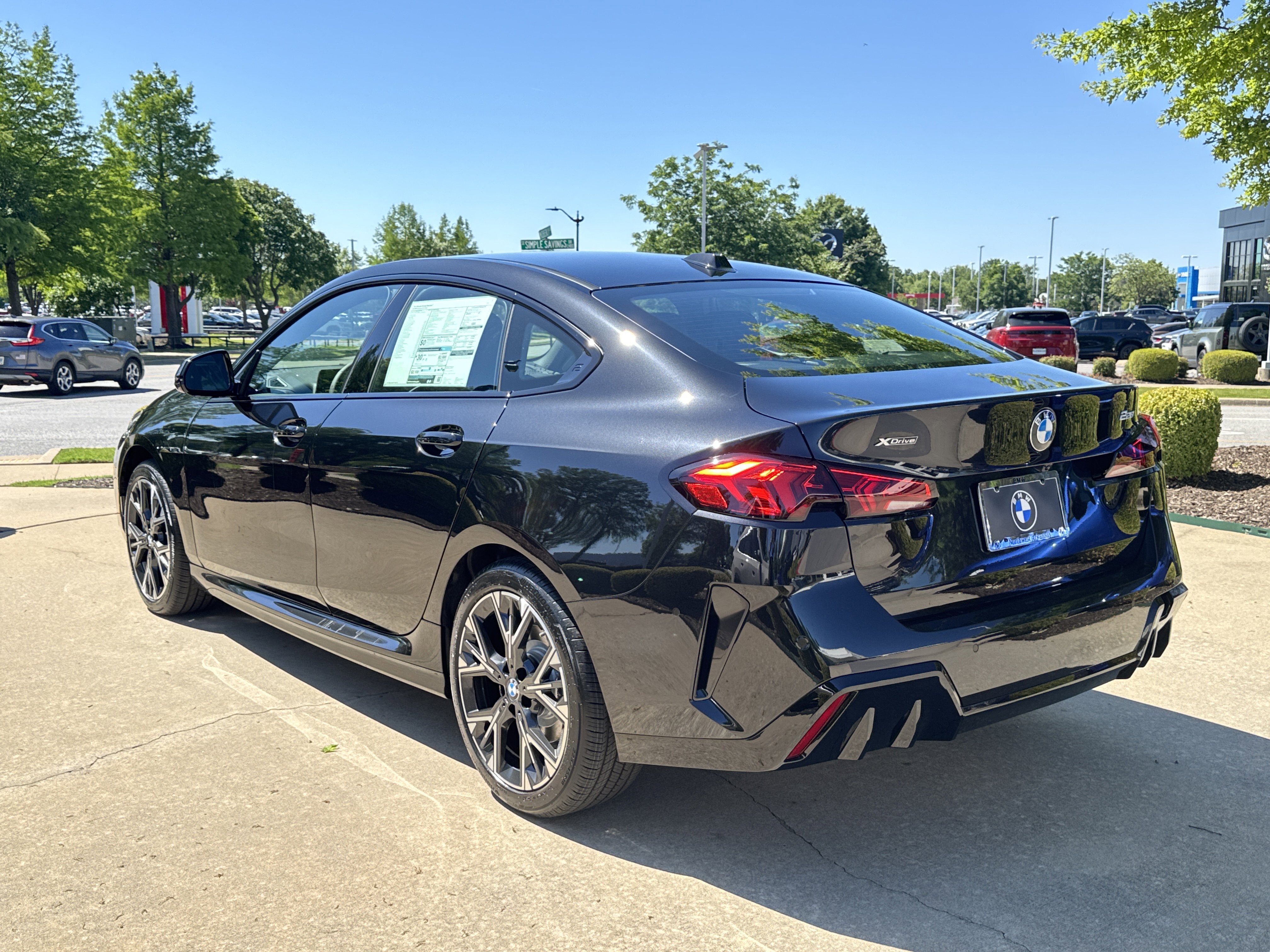 New 2026 0475 Black Sapphire Metallic BMW 228 xDrive image 3
