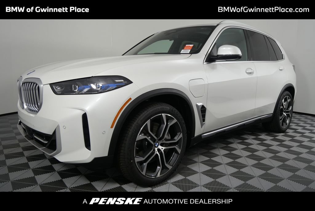 Used 2026 Mineral White Metallic BMW xDrive50e image 1