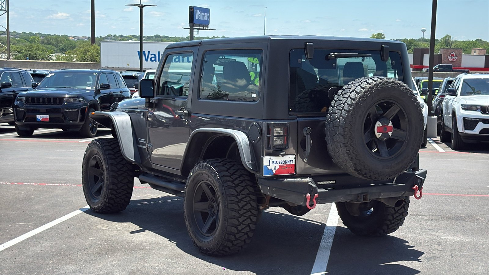 Used 2014 Granite Crystal Metallic Clearcoat Jeep Sport image 3