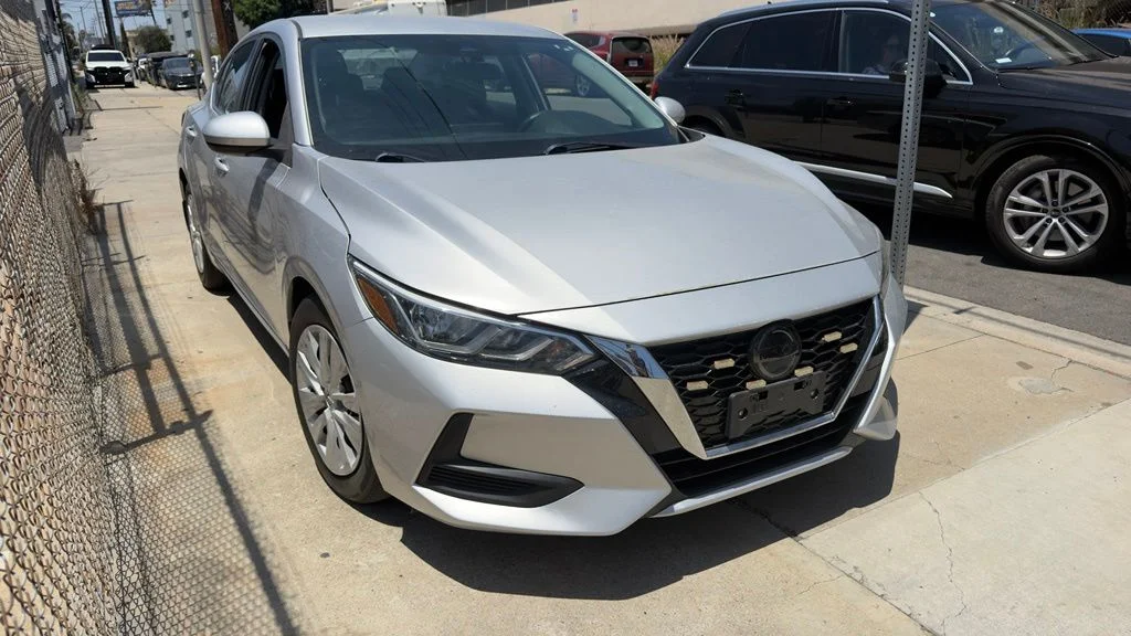 Used 2021 Brilliant Silver Metallic Nissan S image 1