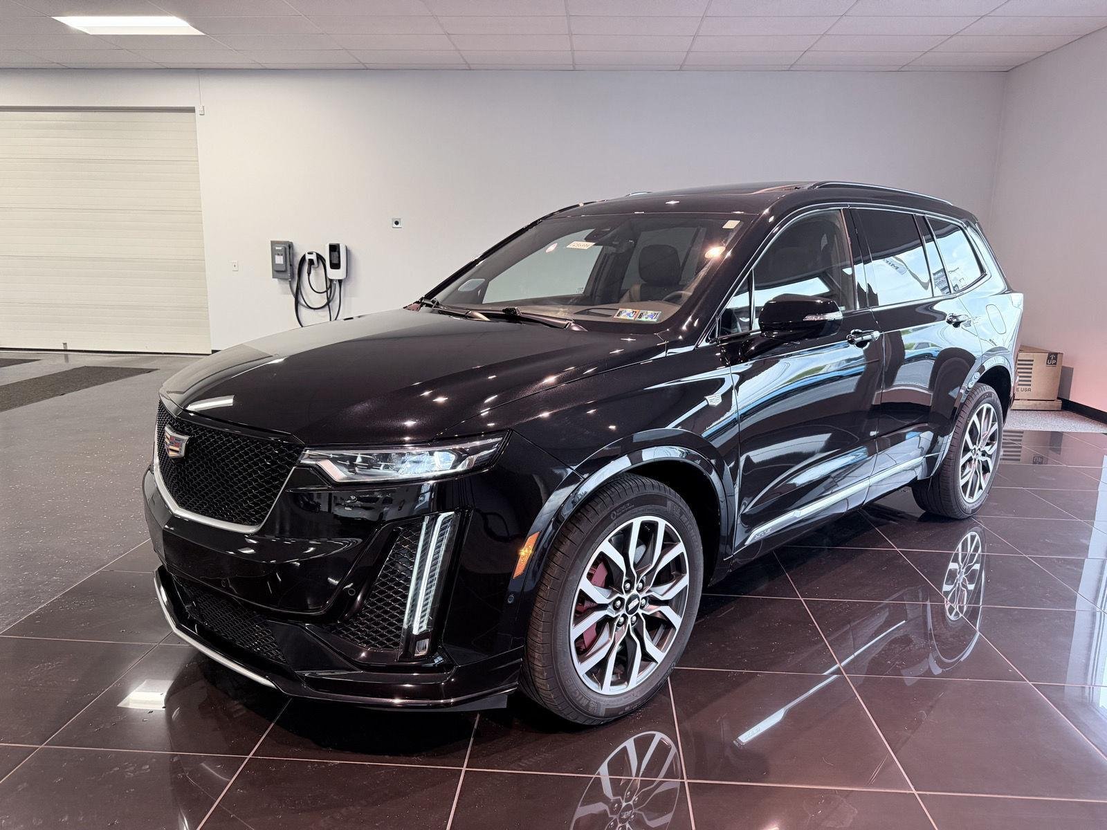 Used 2024 Stellar Black Metallic Cadillac Sport image 2