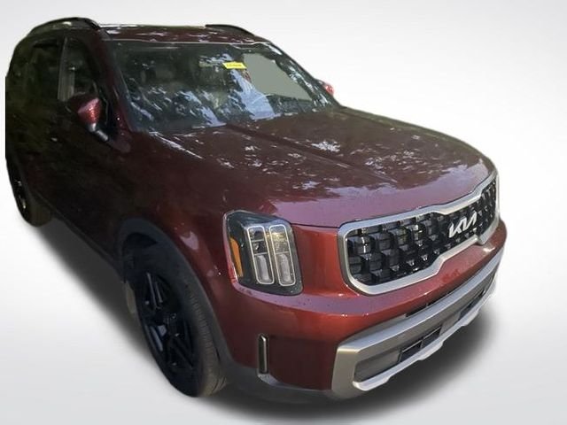 Used 2023 Dawning Red Kia EX X-Line image 1