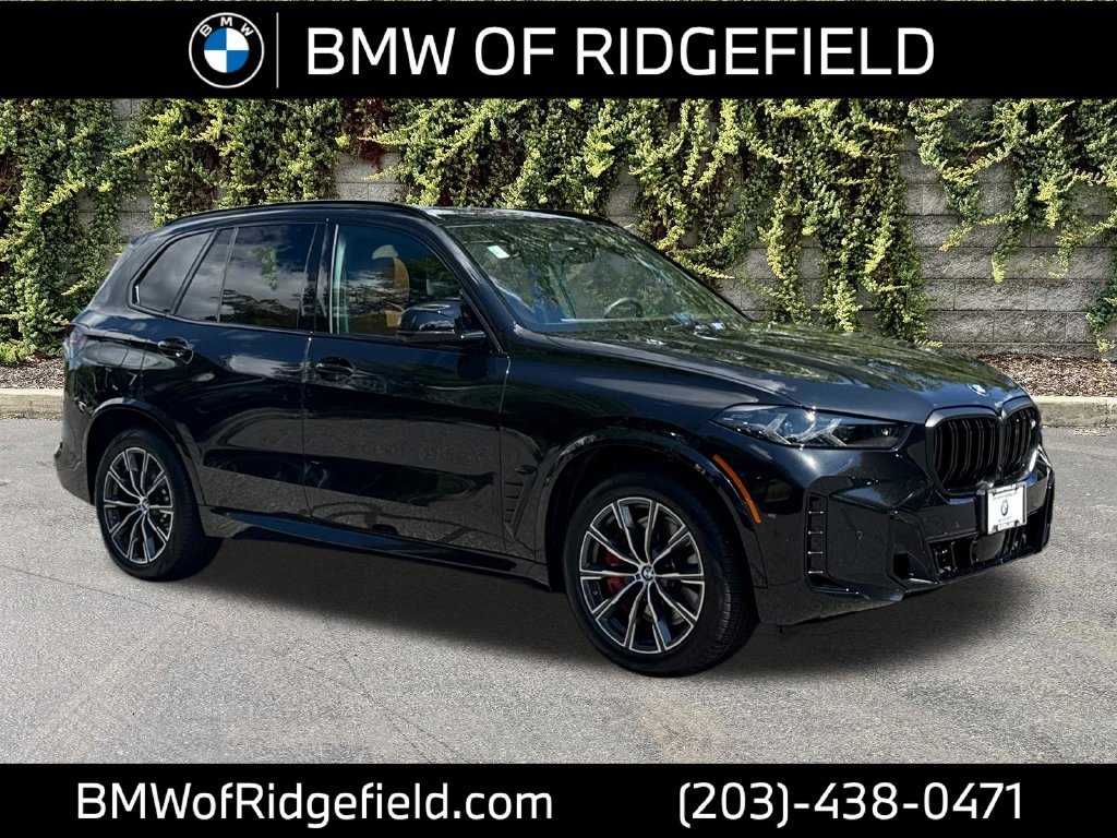 Used 2026 Black Sapphire Metallic BMW M60i image 1
