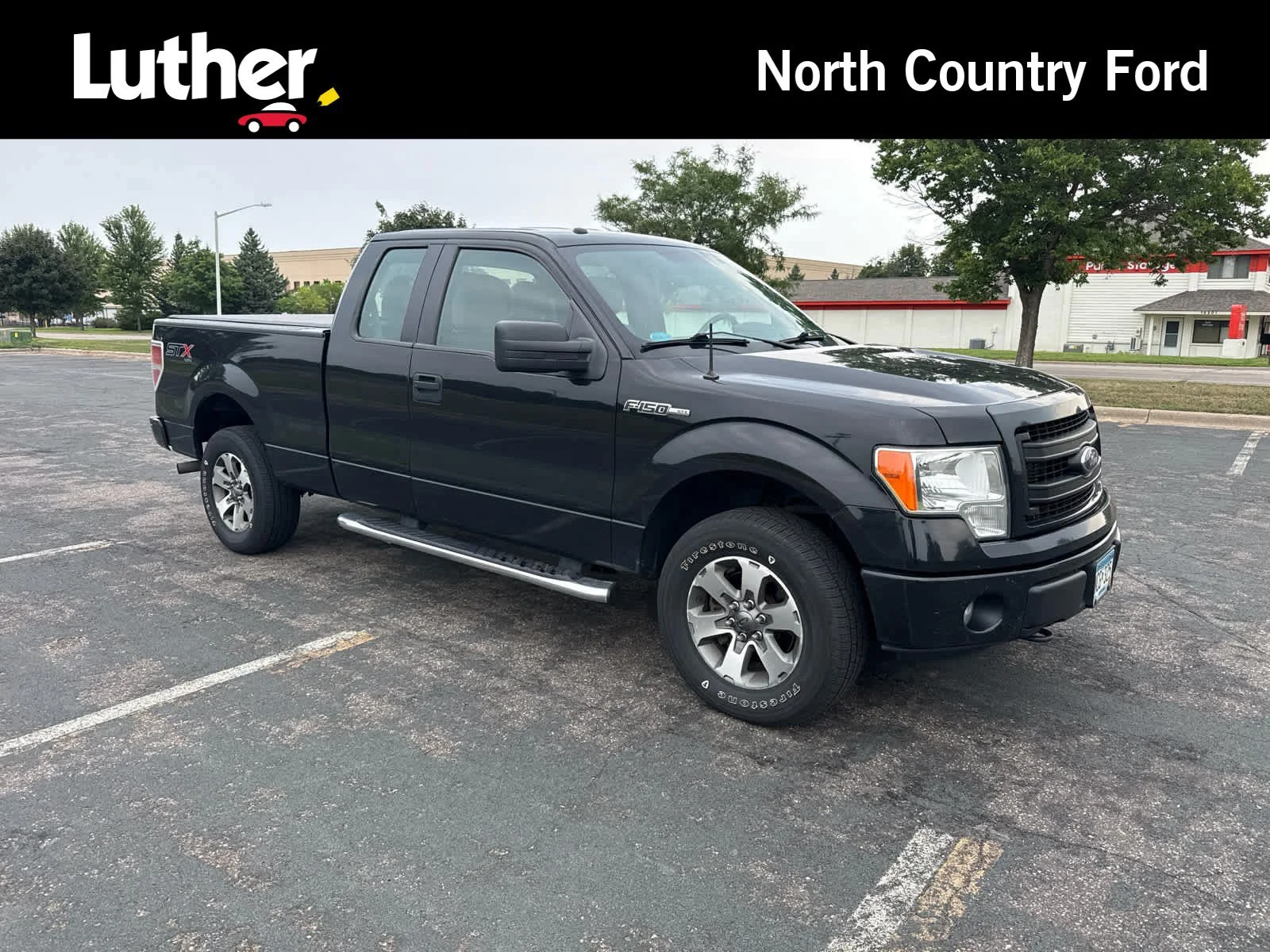 Used 2014 Tuxedo Black Metallic Ford STX image 1
