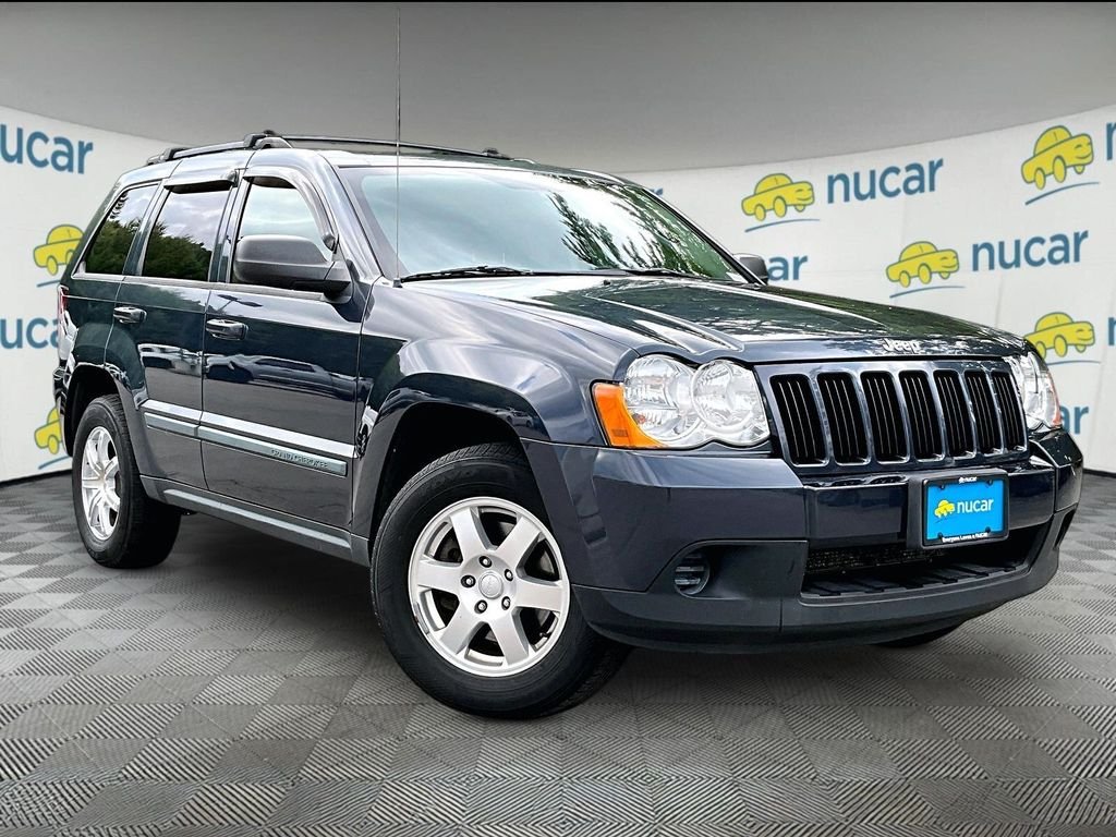 Used 2009 Modern Blue Pearlcoat Jeep Laredo image 1