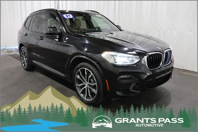 Used 2021 Black BMW xDrive30i image 1