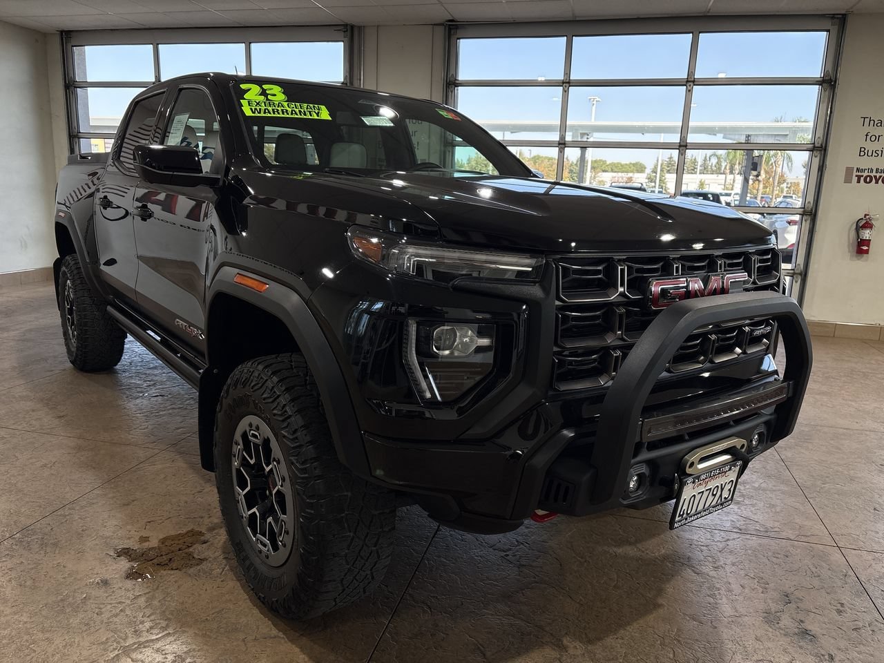 Used 2023 Onyx Black GMC 4WD AT4X image 4