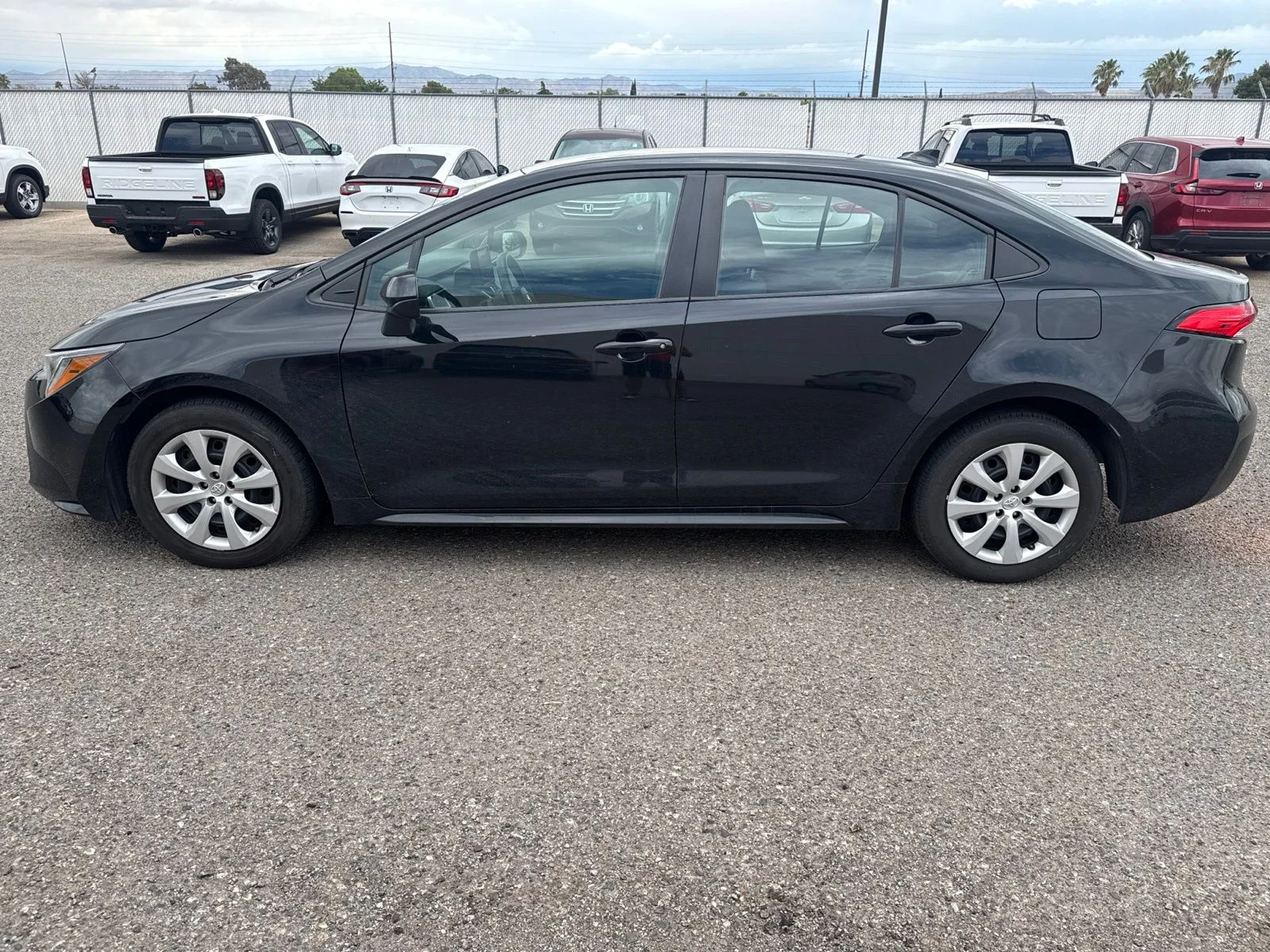 Used 2024 Black Toyota LE image 2