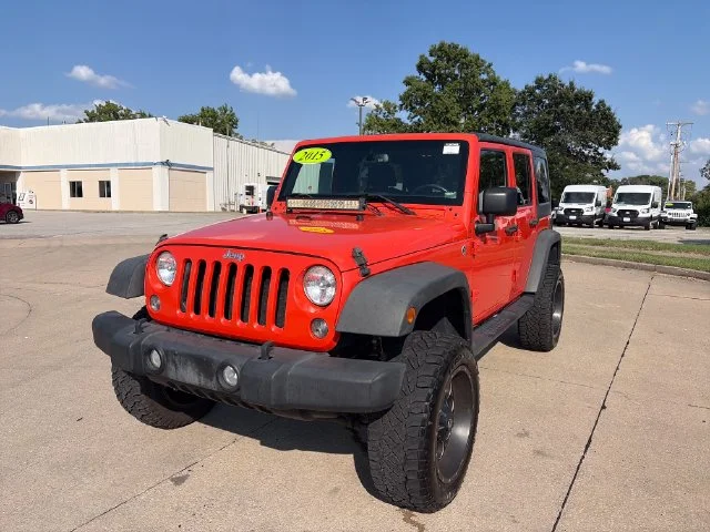 Used 2015 Orange Jeep Unlimited Sport image 1