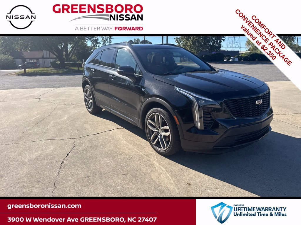 Used 2021 Black Cadillac Sport image 1