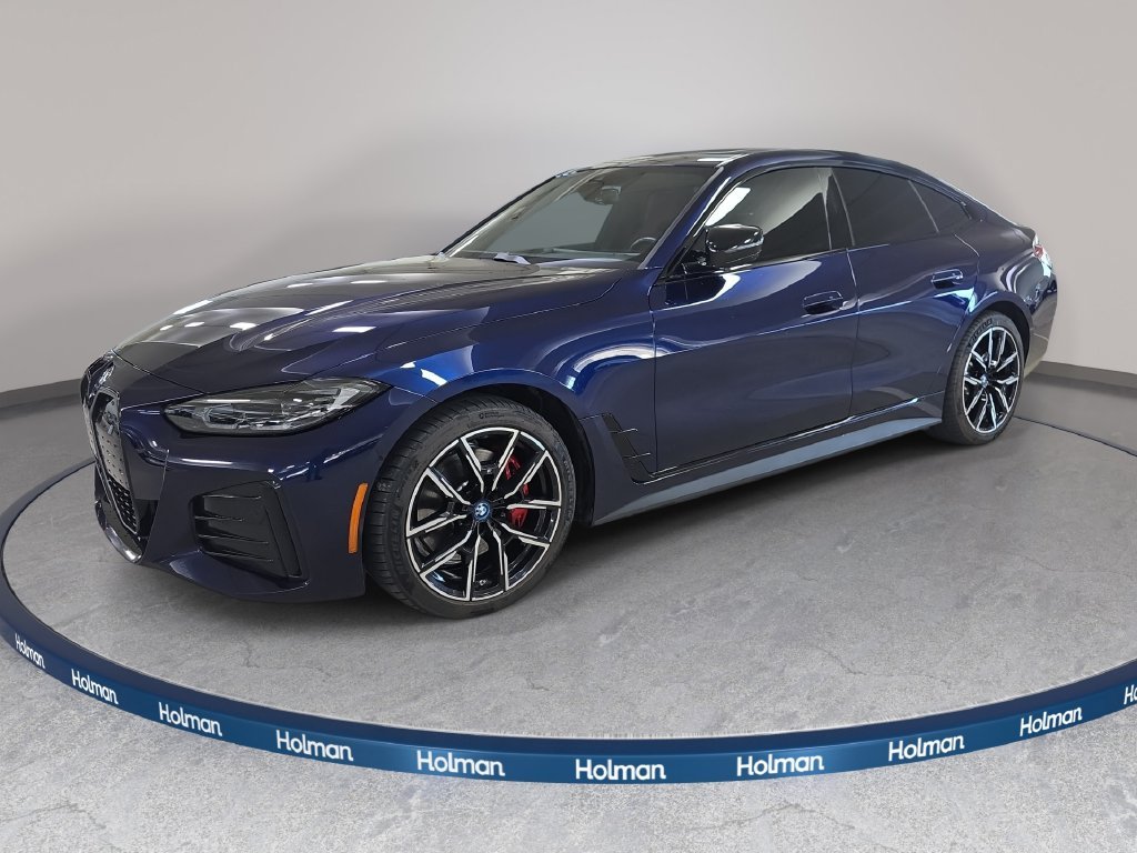 Used 2023 Tanzanite Blue II Metallic BMW eDrive40 image 1