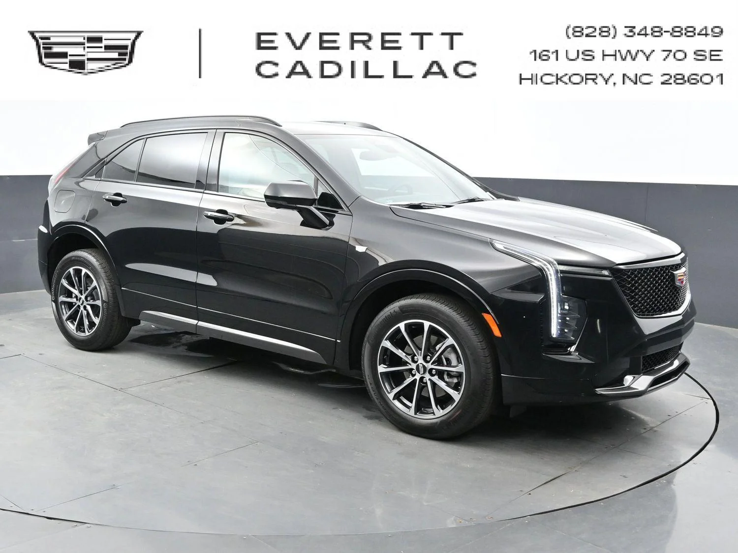 Used 2024 Stellar Black Metallic Cadillac Sport image 1