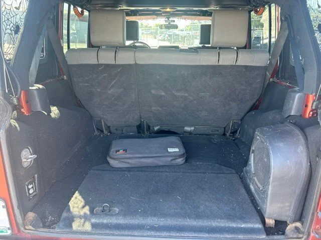Used 2009 Orange Jeep Unlimited Sahara image 14