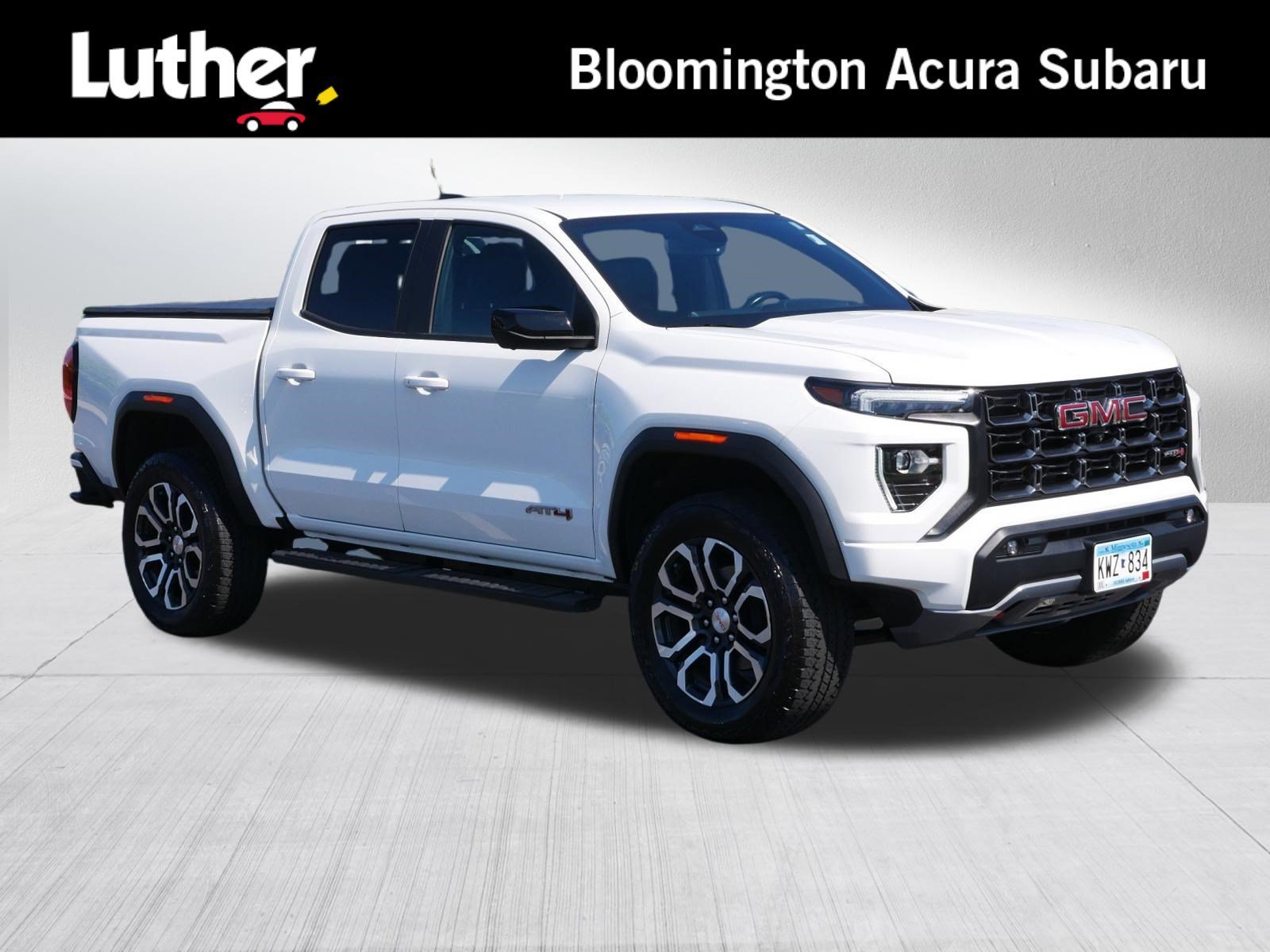 Used 2023 Summit White GMC 4WD AT4 image 1