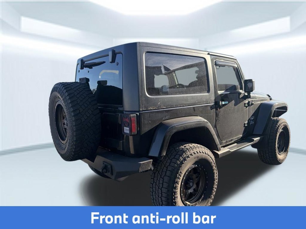 Used 2015 Black Clearcoat Jeep Sahara image 9