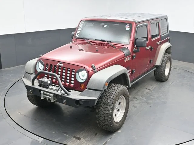 Used 2012 Red Jeep Unlimited Sport image 14