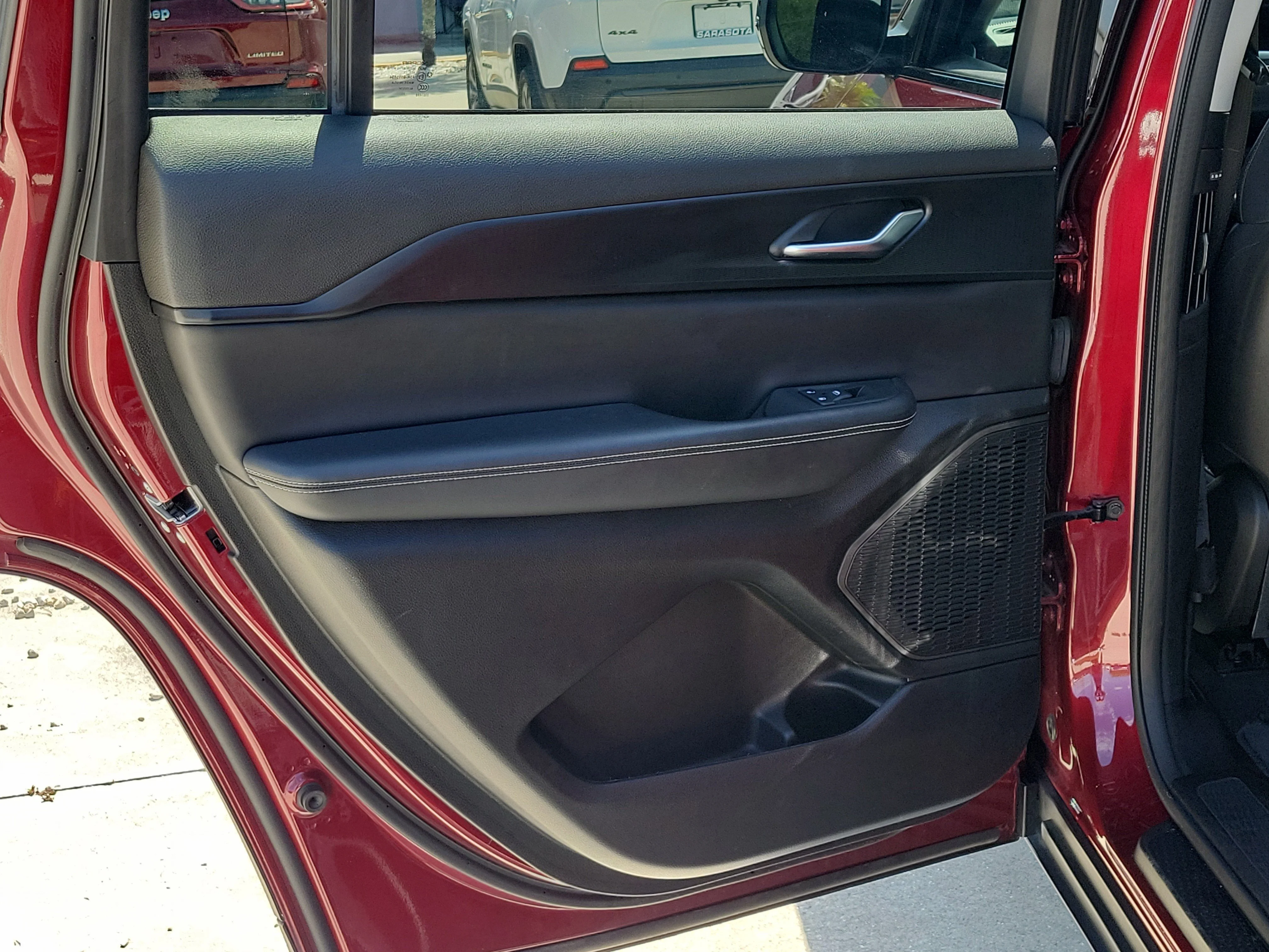Used 2023 Velvet Red Pearlcoat Jeep Laredo image 14
