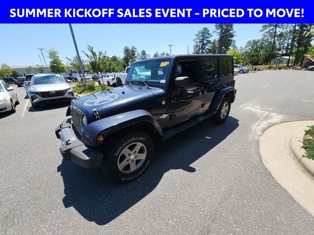 Used 2013 Blue Jeep Unlimited Sport image 7