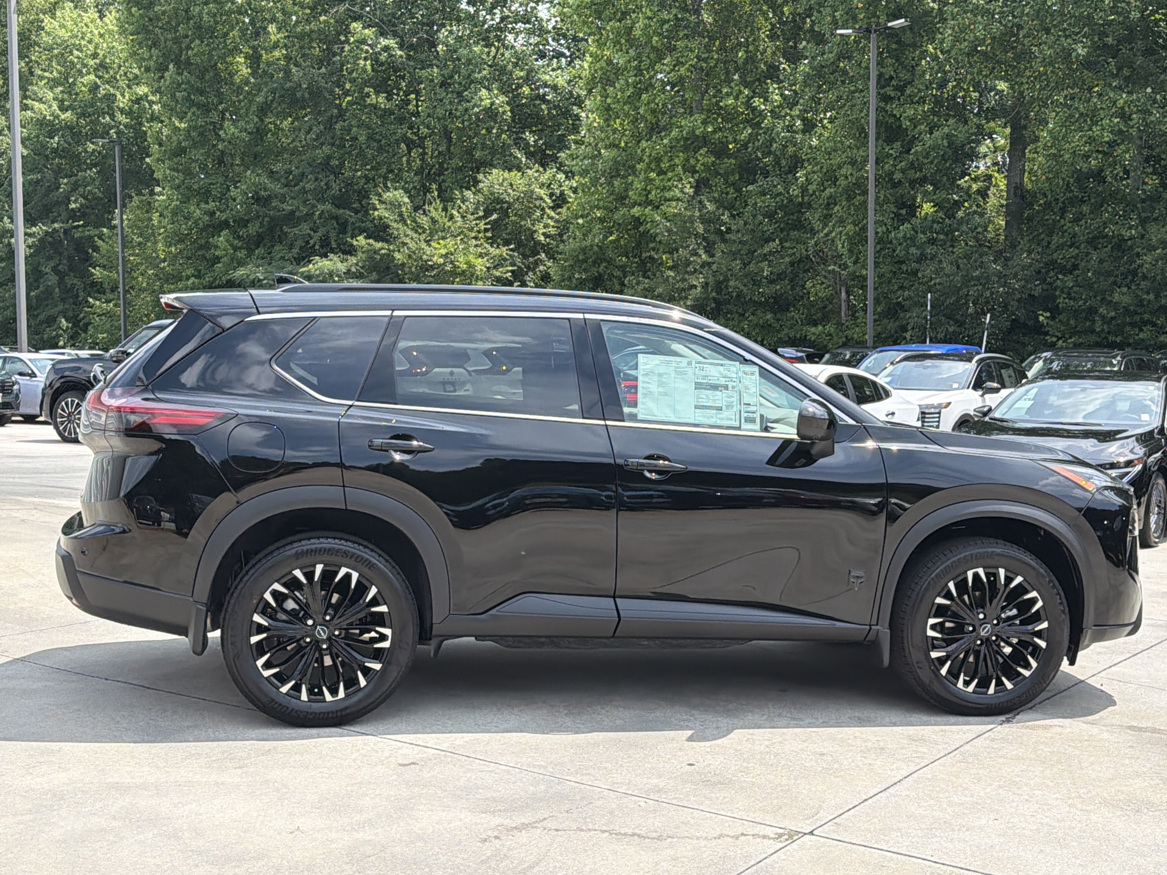New 2026 Super Black Nissan Dark Armor image 9