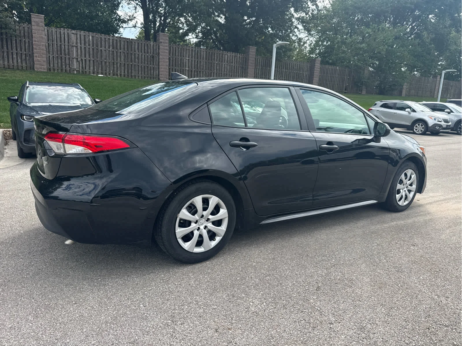 Used 2025 Midnight Black Metallic Toyota LE image 4